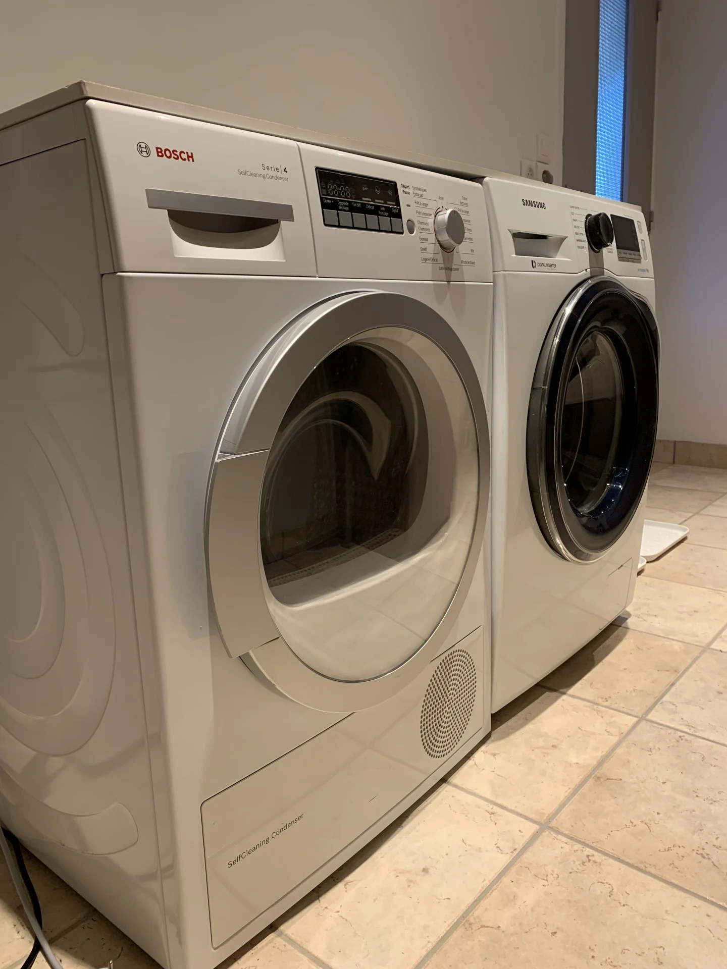 Clothes washer and dryer in storage/laundry room